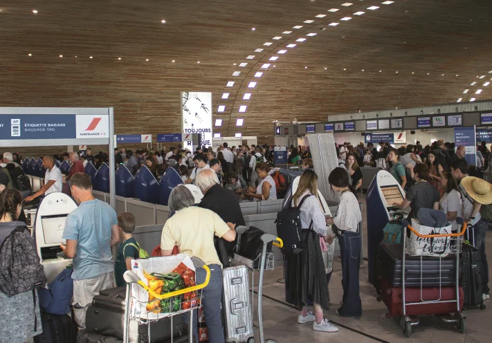 Passengers at airport check-in counters